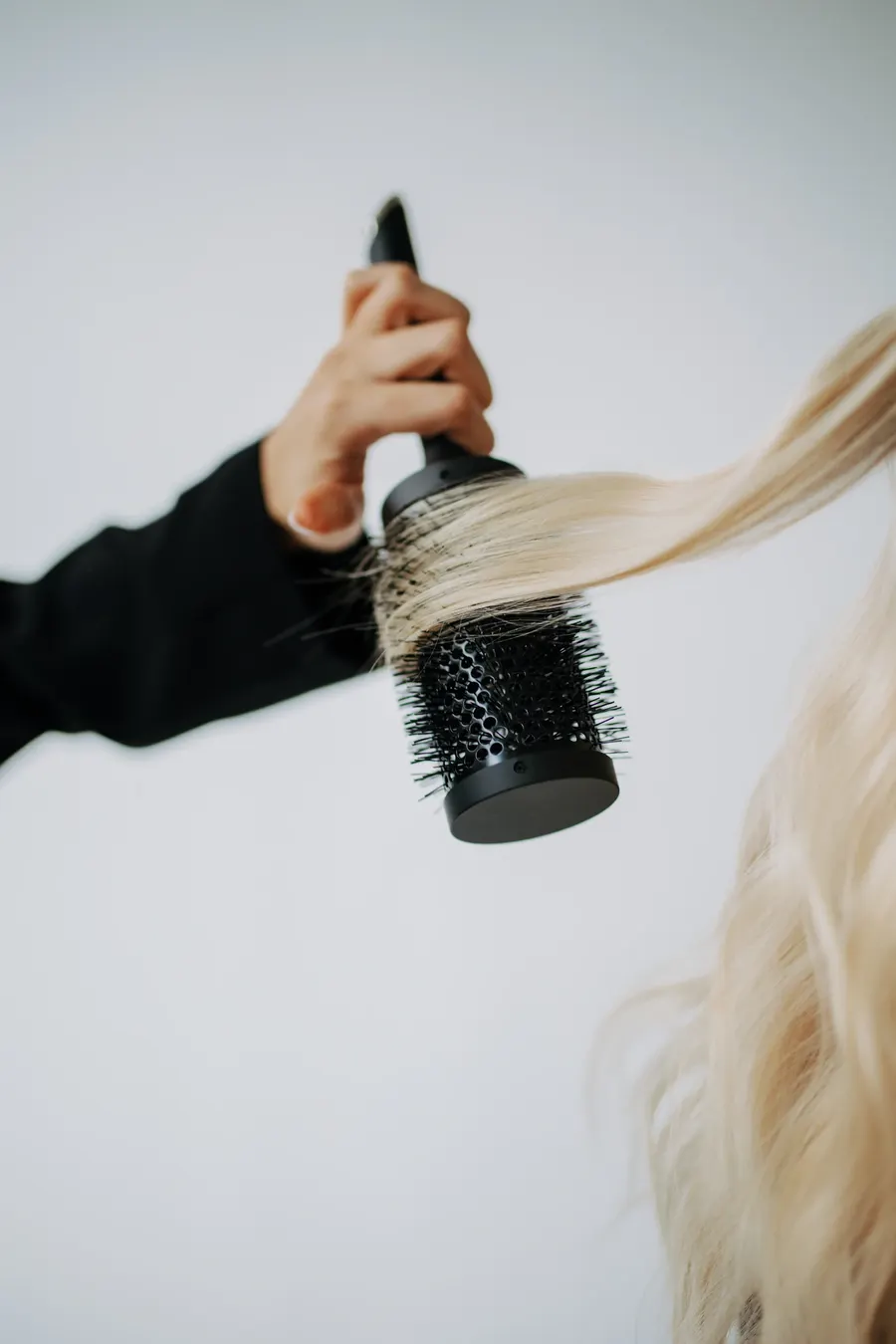 Round-brush blowout on blonde hair